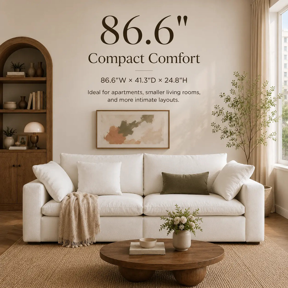 A styled living room scene showing a white compact sofa with white and olive green pillows, a beige throw blanket, a round wooden coffee table, and wall text reading '86.6" Compact Comfort' with dimensions and layout suggestions.